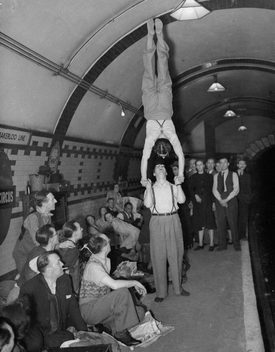 The Storre Brothers, a pair of music hall artistes, entertain their companions underground.jpg