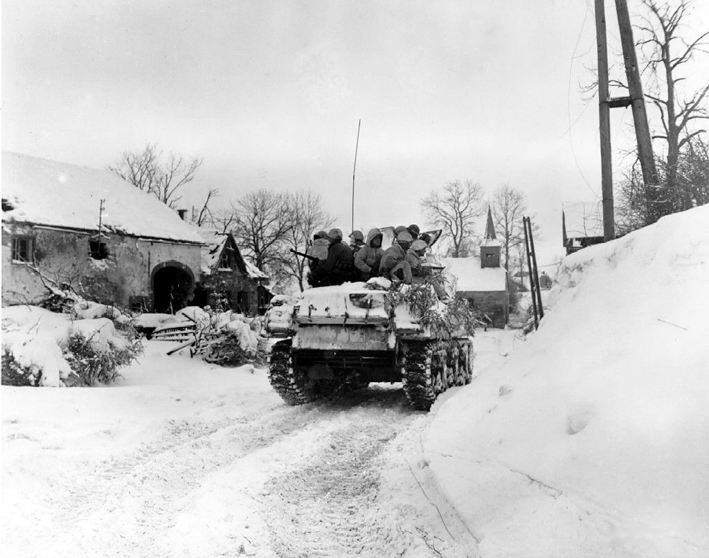 [Photo] Men of Company I, 3d Battalion, 16th Infantry Regiment, US 1st Division riding on M4 Sherman tank at Schopen, Belgium, 21 Jan 1945.jpg