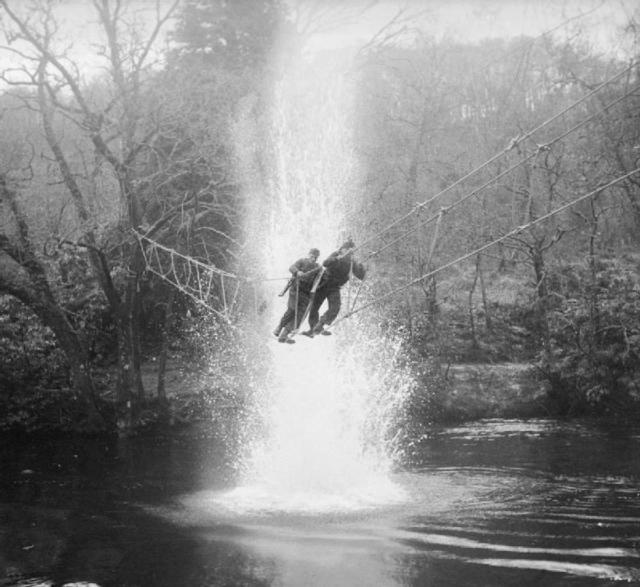 Commandos practice crossing a river using a toggle bridge-Acnacharry_ Jan 1943_.jpg